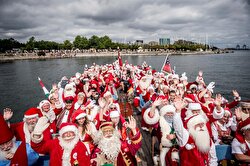 People dressed as Santa Claus take part in the World Santa Claus Congress