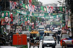 A street is decorated with flags and banners of political parties ahead of a general election in Rawalpindi, Pakistan.