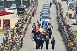 Honor guards carry caskets containing the remains of American servicemen from the Korean War handed over by North Korea upon arrival at Joint Base Pearl Harbor-Hickam in Honolulu, Hawaii