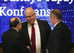 Turkey's Industry and Technology Minister Mustafa Varank (L) and German Federal Minister for Economic Affairs and Energy Peter Altmaier (C) attend the Germany - Turkey Artificial Intelligence Conference in Berlin, Germany on August 22, 2019.
