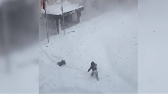 Youths narrowly escape slabs of snow falling ...