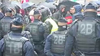 Parisians brave heavy downpour to protest Islamophobia, racism