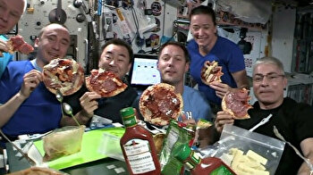 Party time! Astronauts enjoy 'floating pizza' feast in space