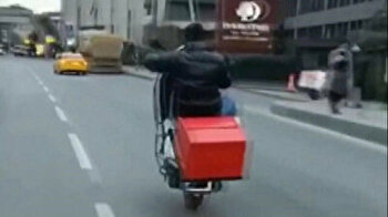 Dangerous ride: motorcyclist drives bike on rear-wheel in central Istanbul