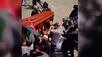 Coffin of slain journalist Shireen Abu Akleh shown nearly falling as Israeli police beat mourners with batons