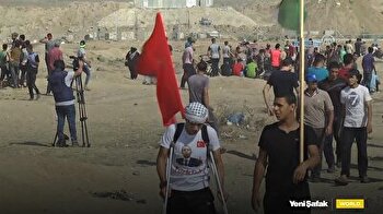 Wounded Palestinian returns to protests on crutches, raises Turkish flag
