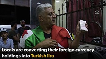 Al-Bab locals exchange cash into lira to support Turkey
