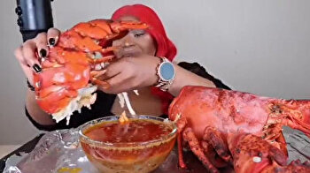 Red-haired girl eats monster lobster