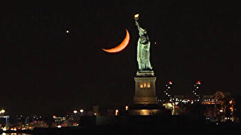 Statue of Liberty and crescent moon create stunning views in NYC