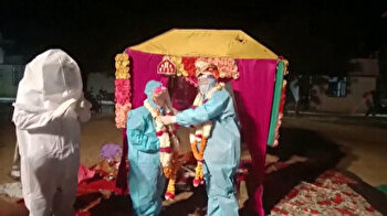 Indian couple ties knot in PPE suits despite bride's COVID-19 diagnosis