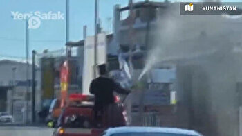 Priest sprays holy water on village from truck in Greece