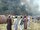 ABD’nin Taliban yönetimindeki Afganistan’a saldırı tehdidine karşı kabaran öfkenin bir göstergesi olarak binlerce protestocunun, Kabil'deki ABD büyükelçiliğini basıp hurda arabaları ve terk edilmiş ofisleri ateşe vermesini izleyen Afganlar. Eylül, 2001.