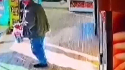 Considerate man takes off muddy shoes before going into market in Turkey