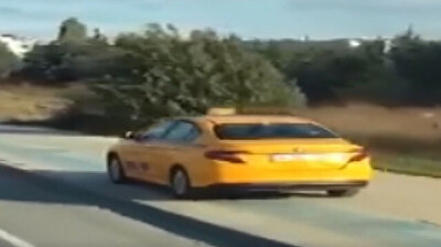 Despicable taxi driver cruising on pavement honks at pedestrian to 'get away' in Turkey