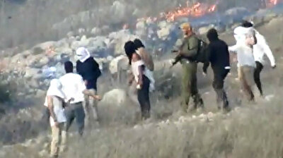 Israeli settlers torch Palestinian lands in West Bank