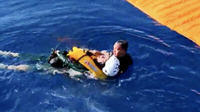 Ukrainian paraglider rescued after crash landing in sea in Turkey's Mugla