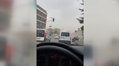 Flying tin roof knocks man off motorbike amid strong winds in Istanbul