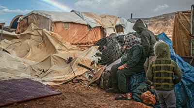 Children shiver in icy cold as storm upends tents in Syria's Idlib
