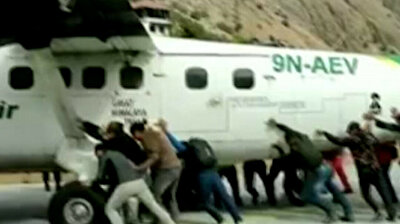 Passengers push plane off runway after aircraft’s tire bursts in Nepal