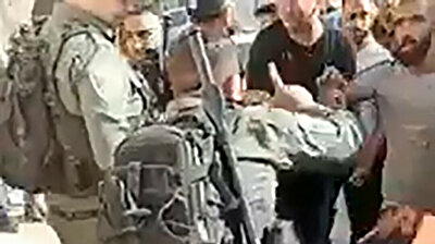 Israeli police run over, arrest boy for carrying Palestinian flag on bicycle