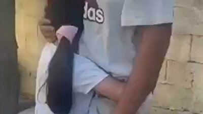 Little Palestinian girl consoles her crying father after Israel forces home demolition