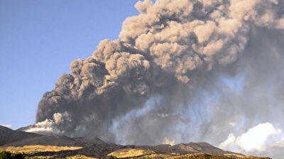Clouds of black smoke rise from erupting Mount Etna