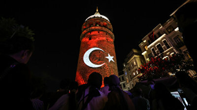 Istanbul's Galata Tower shimmers with colors of Turkish flag on Victory Day