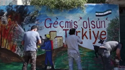 Syrian artist expresses solidarity with Turkey as it battles wildfires through mural