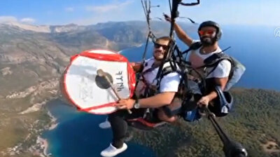 Adventurer plays drum while skydiving over Turkey’s idyllic Oludeniz and underwater