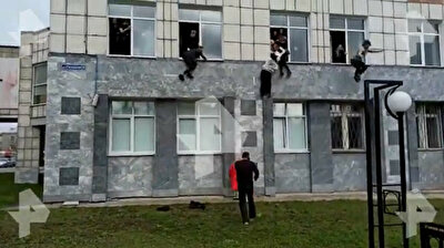 Terrifying footage shows students jumping from windows to escape gunman at Russian university
