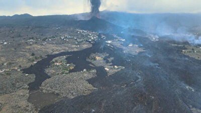 La Palma volcano leaves path of destruction as lava flows toward sea