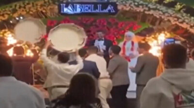 Giant tire welcomes bride and groom into wedding hall in bizarre trucker ceremony