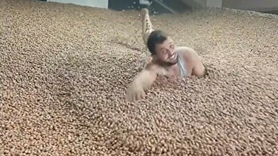 Unhygienic man swimming in pool of hazelnuts faces backlash in Turkey