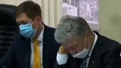 Former Ukrainian president Petro Poroshenko falls asleep at his own trial