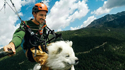 French film director paraglides with his adorable dog using custom-made harness