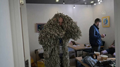 Ukrainian volunteers weave ghillie suits for army snipers