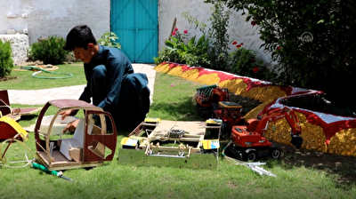 Afghan student makes replica vehicles from recycled materials