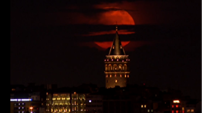 Marvelous Strawberry Supermoon dances with Galata Tower in historical Istanbul