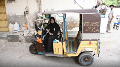 Young Pakistani woman drives auto rickshaw to earn livelihood