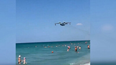 Russian warplane flights at low altitude over beachgoers in Crimea