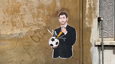 Mural shows Juventus chairman stabbing soccer ball with knife
