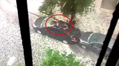 Man uses own body to shield car from hail