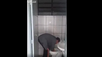 Man washes face with toilet bowl water