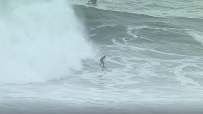Surfers stick around after event to ride the huge waves of Nazare