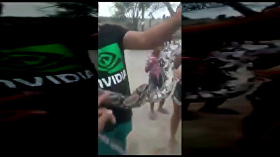 Man gets bitten in the face while playing with snake