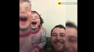 Syrian dad helps little girl avoid trauma by teaching her to laugh as bombs fall