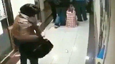 Chinese woman spits all over metro station notice board in Spain