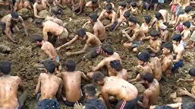 Jubilant Indians celebrate end of Diwali by playing around in cow dung