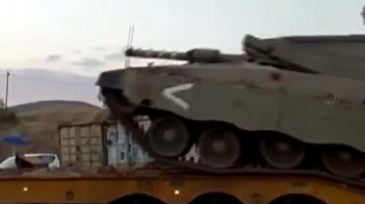 Israeli army tank overturns, nearly crushing soldier nearby