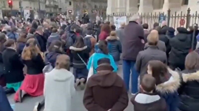 Catholics protest ritual ban by singing hymns in front of Paris church